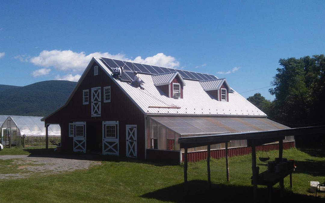 Installing solar panels on a barn