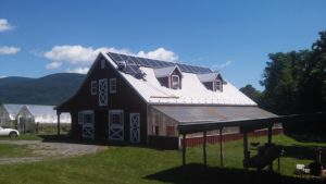 Installing solar panels on a barn