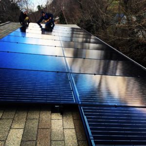 Solar panels on a roof with shingles