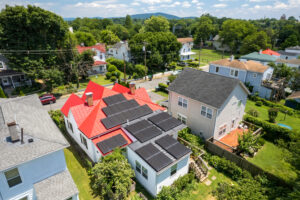 Red roofed house with solar array
